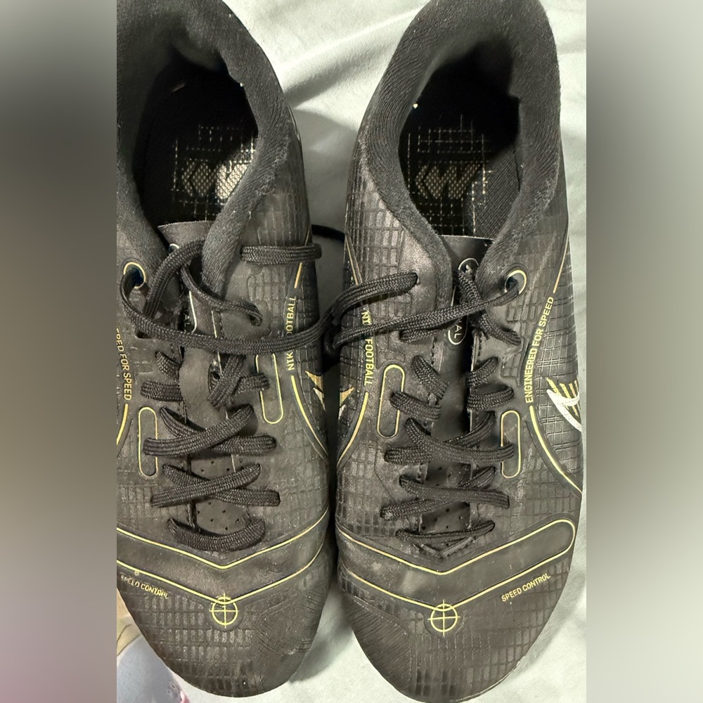 Nike Black Sneakers with Gold Highlights